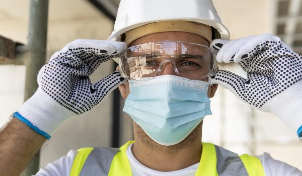 worker-wearing-safety-glasses-on-construction-site